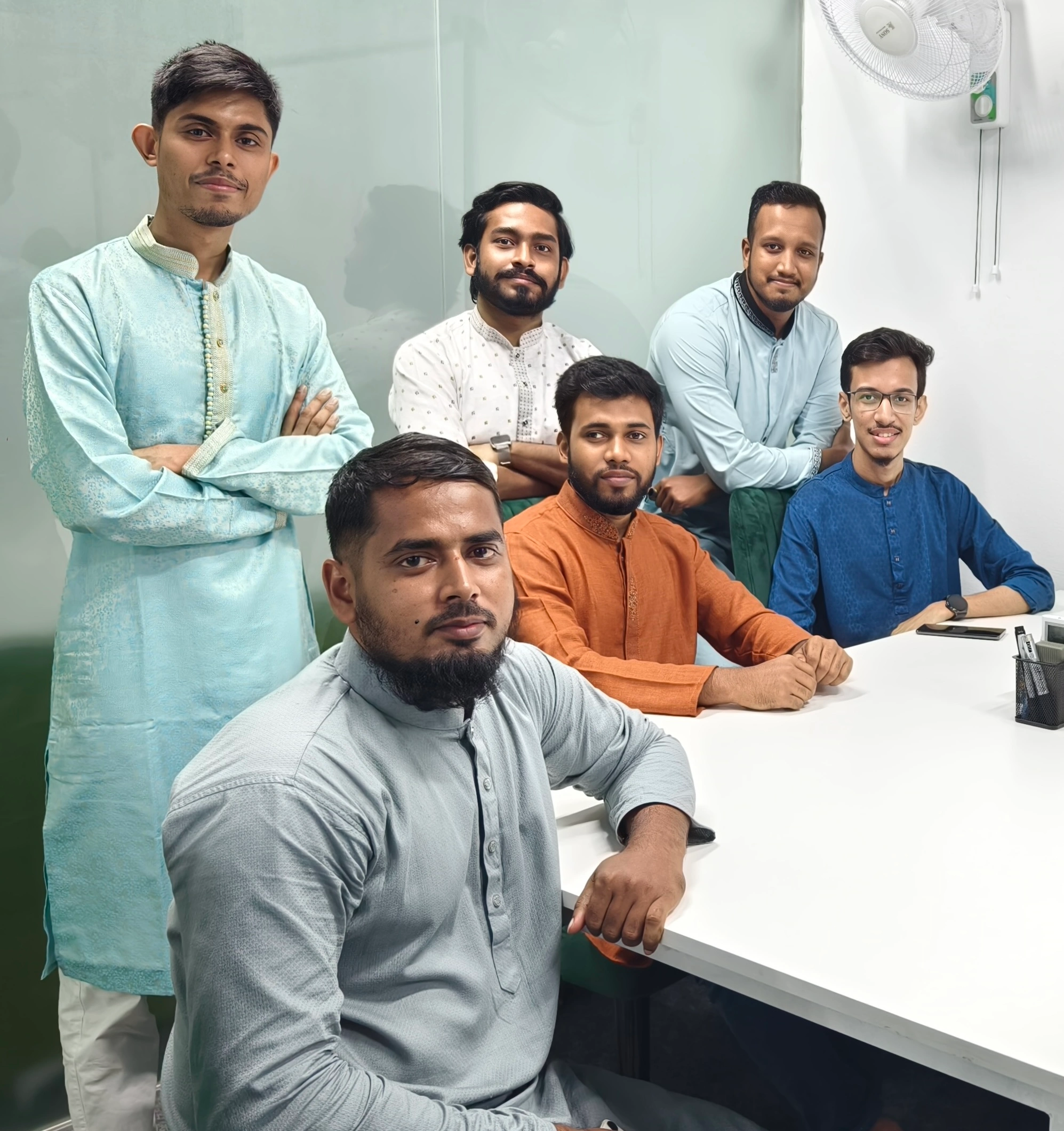 Colleagues playing foosball in modern office